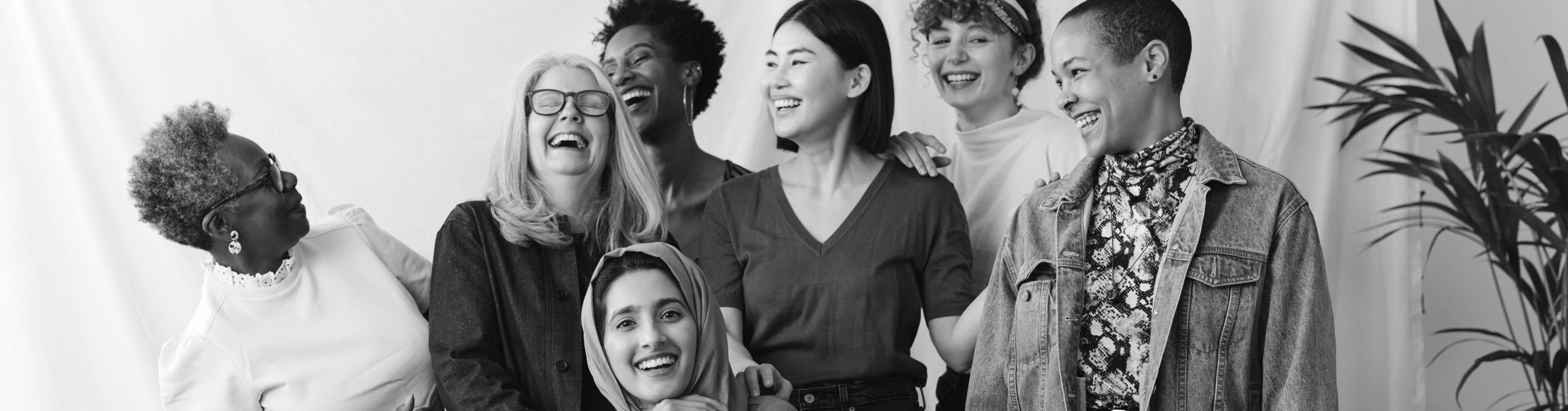 Portrait of cheerful mixed age range multi ethnic women celebrating International Women's Day